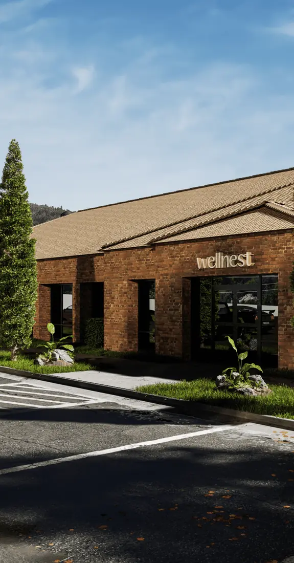 Street view render of a brick wellness centre with landscaped forecourt